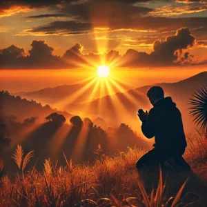 A person kneeling in prayer as the sun rises symb